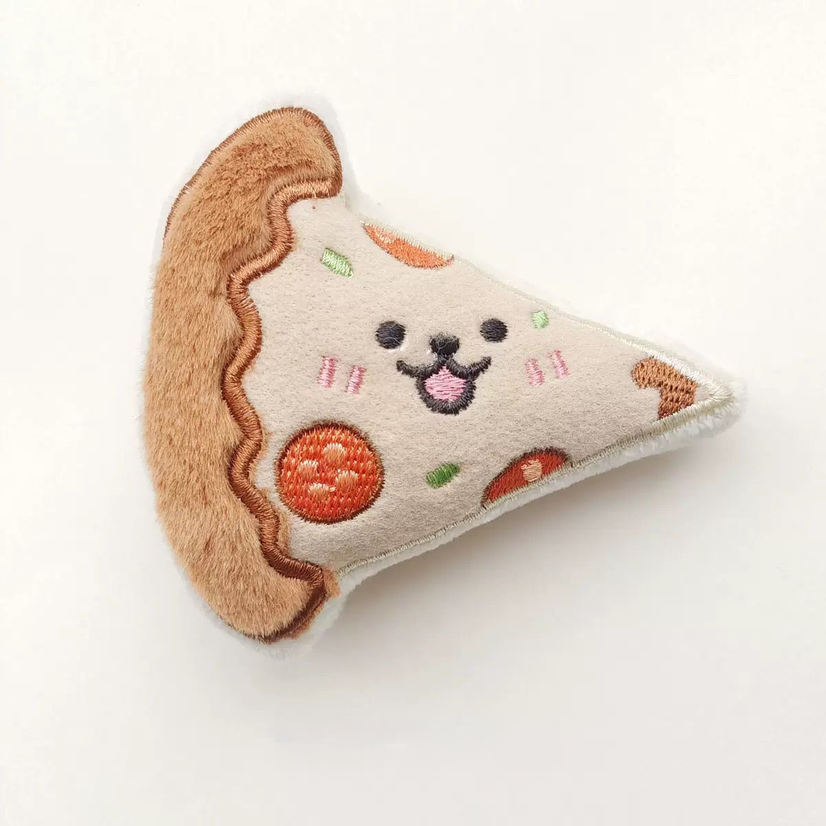A 9.5cm happy pizza slice plush toy with embroidered pepperoni and a cute smiling face for small dogs