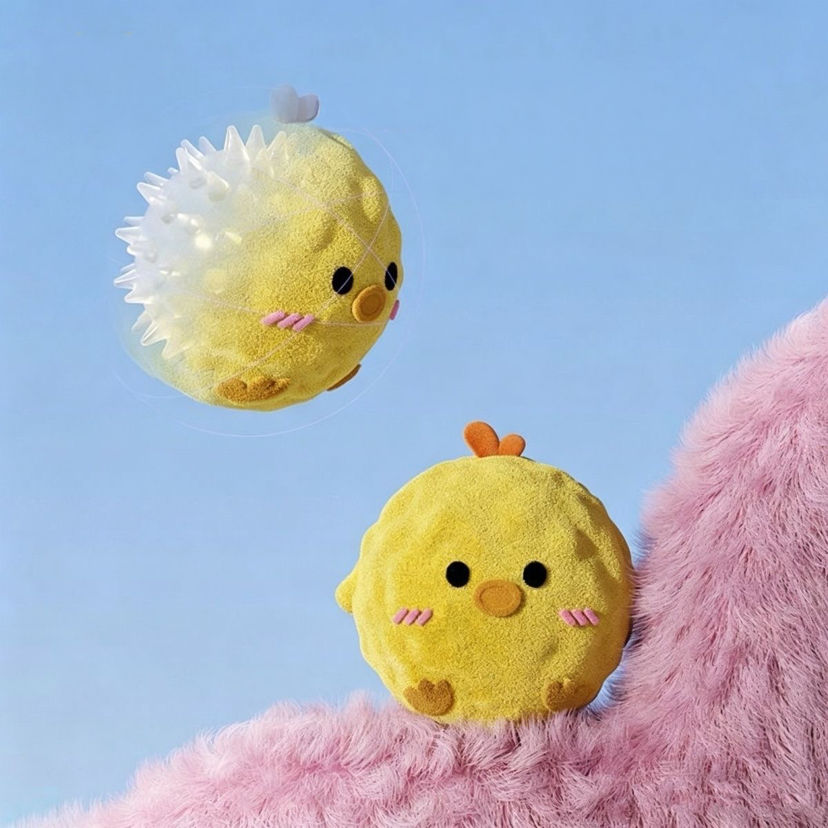 A graphic showing the Yellow Chick plush toy with a transparent overlay, revealing the hidden TPR spiky ball core inside that provides the squeak and erratic bounce.