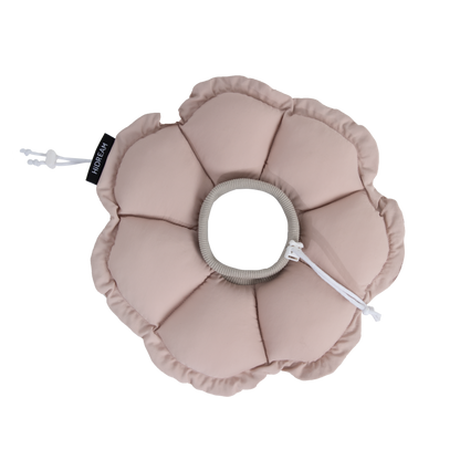 The Chestnut Pink variant of the HiDREAM soft flower recovery collar on a black background, showing the plush petal design and grey ribbed neckband.