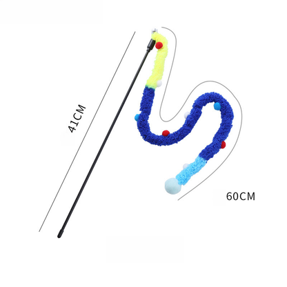 A black interactive cat teaser wand displayed against a white background with a multi-colored plush tail in yellow, blue, and pastel shades, featuring numerous small pom-poms. Lines and text mark the dimensions: a line labeled "41cm" along the wand and a curved line labeled "60cm" for the tail, which is designed to slither like a fuzzy snake and awaken panther instincts.