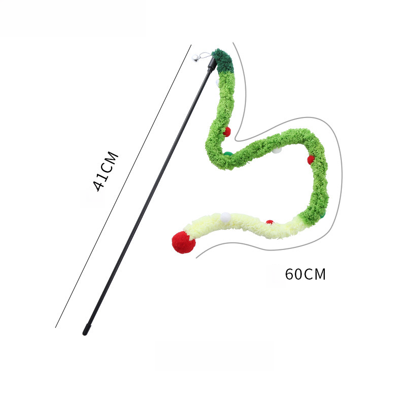 A black interactive cat teaser wand with a long, wavy, green, red, and white plush tail featuring multiple green, red, and white pom-poms and a large red pom-pom tip. Dimenson lines on the white background indicate a "41cm" length for the wand and a curved "60cm" for the tail, designed to provide safe claw and bite play while building a profound bond.