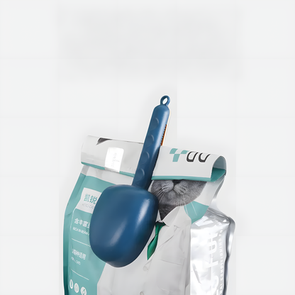 A blue pet food scoop clipped onto a bag of cat kibble. The 2-in-1 design seals the bag to keep food fresh and ensures the scoop is always easy to find