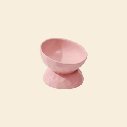 Pink Peture Elevated Feeder with a raised pedestal design. The non-porous ceramic glaze ensures acne-free hygiene, while the height protects the cervical spine