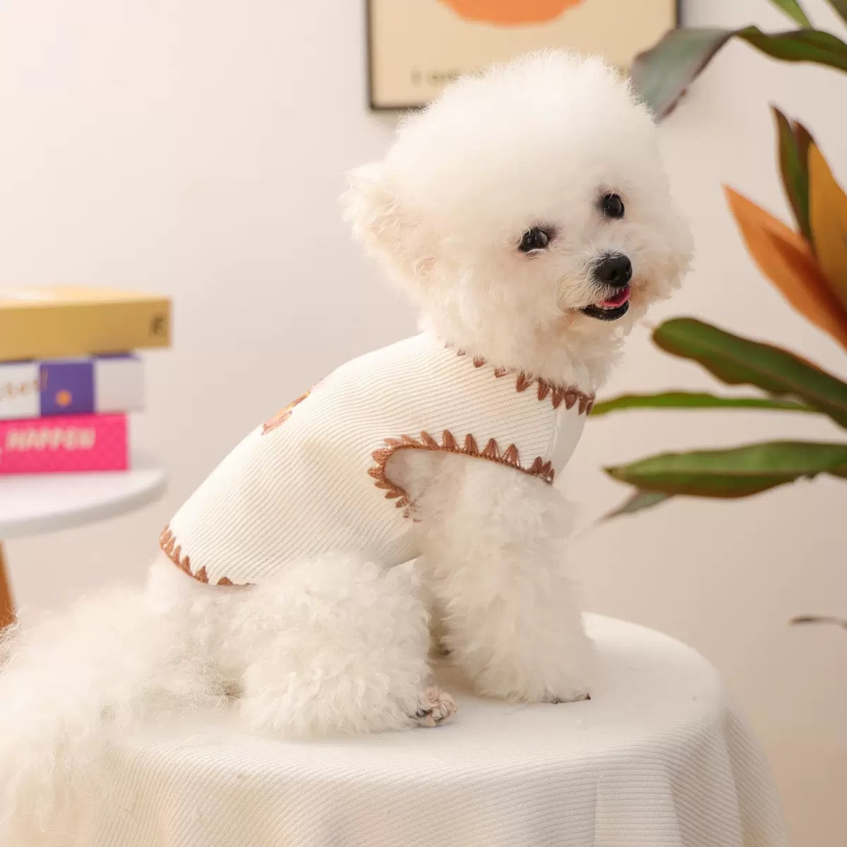 Side profile of a small dog in the white summer vest. The sleeveless silhouette allows for maximum airflow and freedom to zoom without restriction