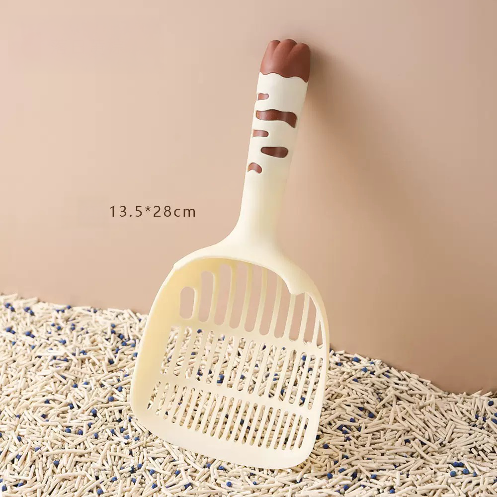 Butter yellow cat litter scoop with a chocolate brown paw print handle. A warm, aesthetic tool featuring a 13.5cm wide mouth for fast sifting of tofu and clay litter