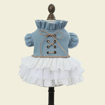 Front display of the western-style dog dress on a mannequin, highlighting the authentic bronze-tone eyelets and soft brown cord corset design