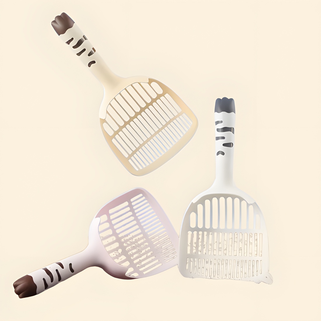 Three Big Mouth Cat Litter Scoops floating in cream, pink, and blue. Features an adorable &