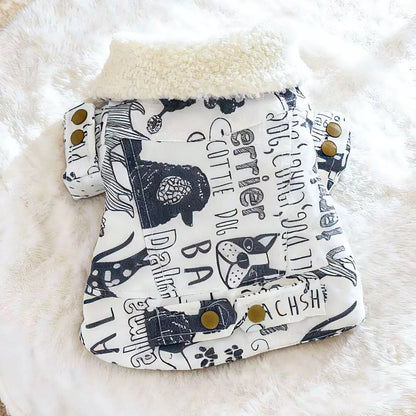 Flat lay of the graffiti dog coat featuring typography of various breeds like Terrier, Scottie Dog, and Dalmatian. A conversation starter for dog parks