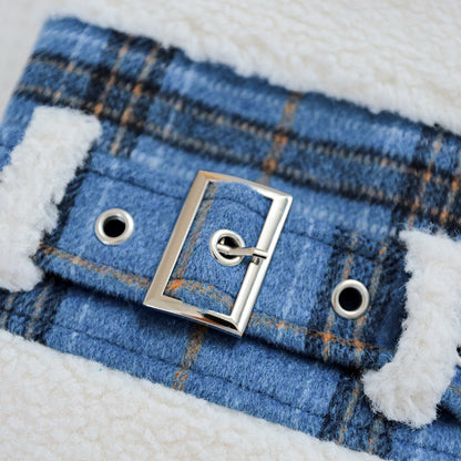 Close-up of the classic silver buckle belt on the blue plaid fabric. Adds a preppy, old-money aesthetic to the winter dog coat