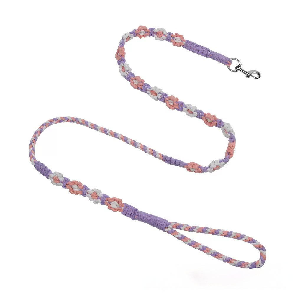 Purple macrame dog leash featuring a unique hand-woven flower pattern. A stylish, boho-chic accessory for fashionable pups