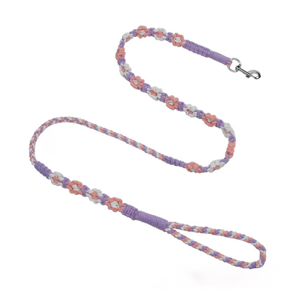 Purple macrame dog leash featuring a unique hand-woven flower pattern. A stylish, boho-chic accessory for fashionable pups
