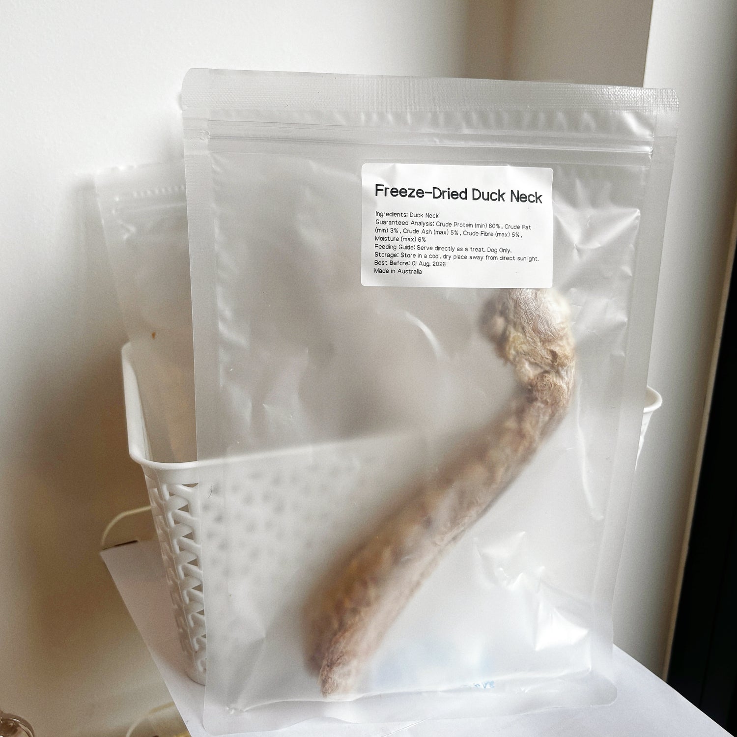 Single pouch of Freeze-Dried Duck Neck showing 60% minimum protein, hypoallergenic "cooling" meat treat for sensitive dogs