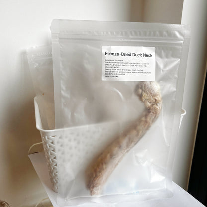 Single pouch of Freeze-Dried Duck Neck showing 60% minimum protein, hypoallergenic "cooling" meat treat for sensitive dogs