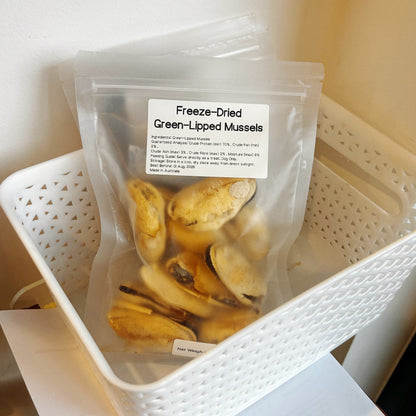 Multiple bags of green-lipped mussels in a basket, a potent natural anti-inflammatory superfood for senior dogs and active breeds.