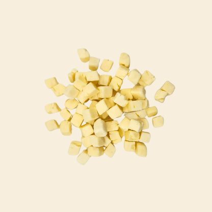 Freeze-dried cheese cubes for dog training, 100% real Australian cheese, high-value calcium-rich rewards for positive reinforcement.