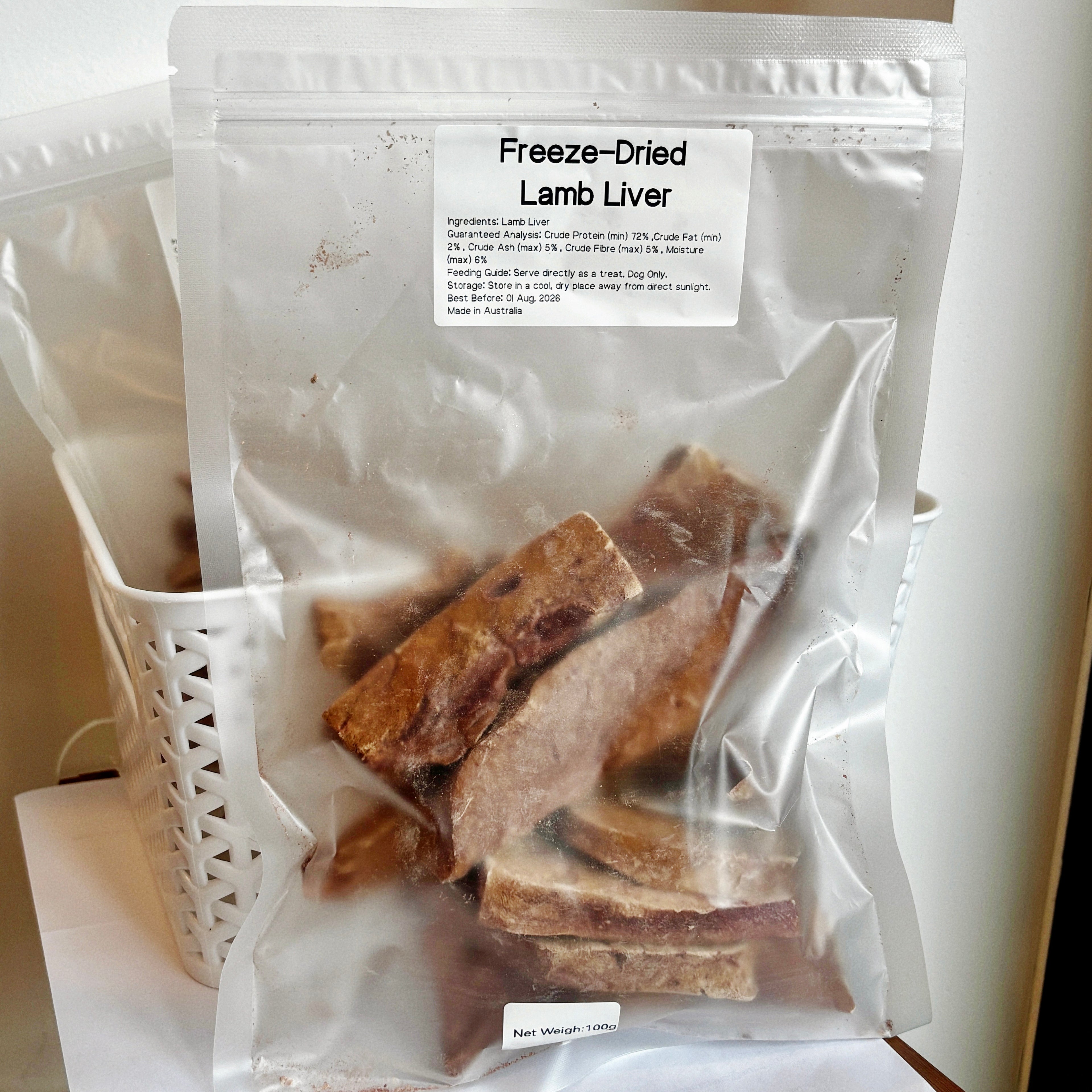 A 125g bag of Freeze-Dried Lamb Liver dog treats, showing 72% protein content, perfect high-value reward for dog training.