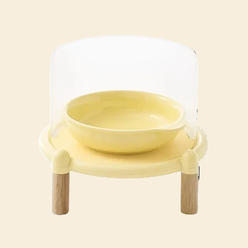 Front view of the Mango Splash-Proof Elevated Bowl Set in yellow, featuring a semi-transparent anti-mess shield and stable wooden legs