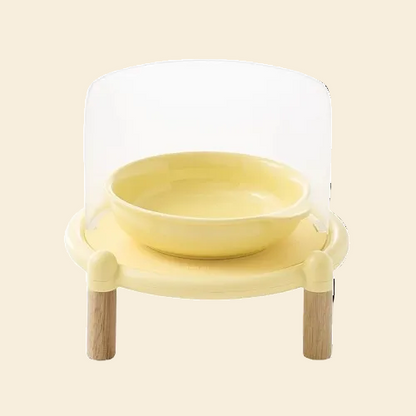 Front view of the Mango Splash-Proof Elevated Bowl Set in yellow, featuring a semi-transparent anti-mess shield and stable wooden legs