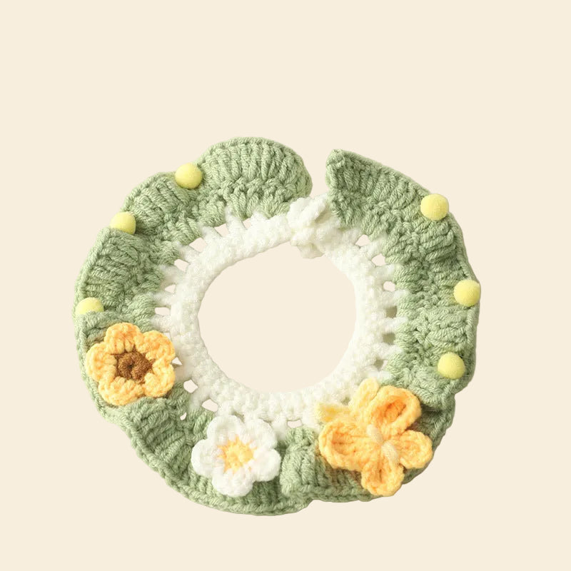 Flat lay of the Matcha Garden Floral Knit Collar. Hand-crocheted from soft milk cotton yarn featuring 3D sunflowers and daisies for a cottagecore aesthetic