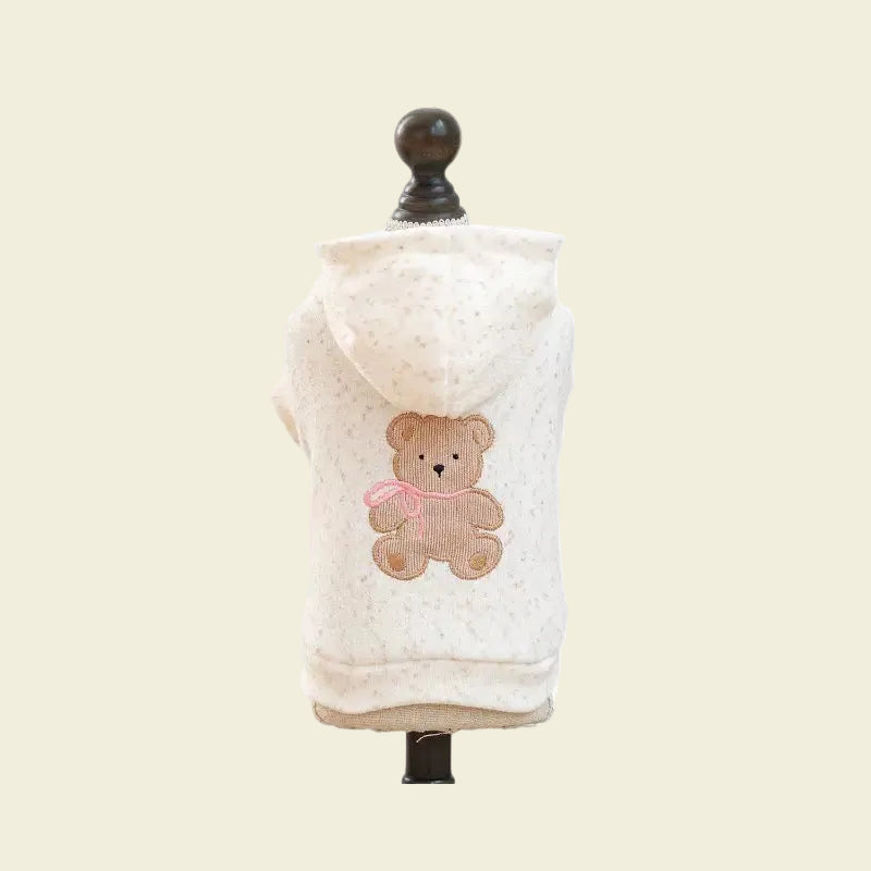 Rear display of the Teddy Hug Hoodie on a mannequin, showcasing the nostalgic bear detail and the clean, minimalist aesthetic for fashion-forward pet parents