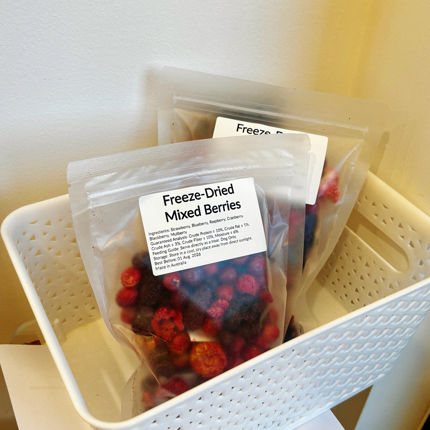 Multiple packs of Mixed Berries in a basket, grain-free fruit treats providing urinary tract support and brain health for dogs.