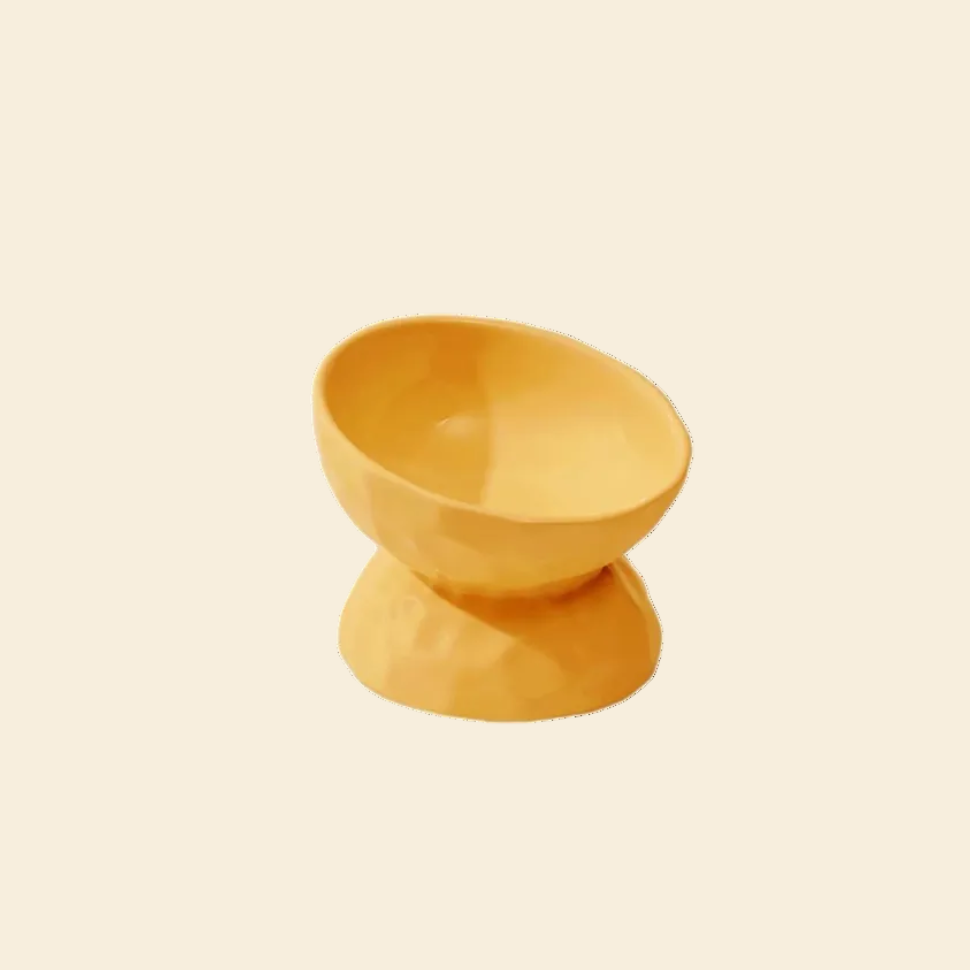 LéJoyee Peture Elevated Ceramic Cat Bowl in yellow, featuring a unique hammered stone texture and a 15° tilt to assist digestion and prevent vomiting