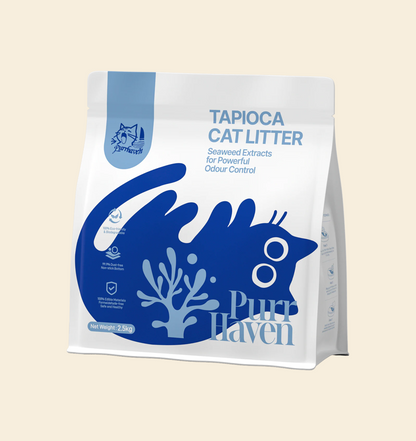 An isolated studio shot of the PurrHaven Tapioca Cat Litter bag. The packaging features a blue cat silhouette and seaweed extract icons, emphasizing its natural and safe formula for cats.