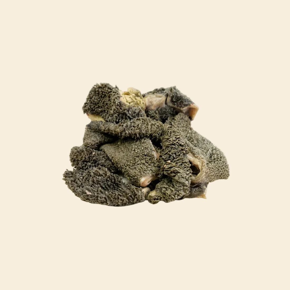 Close-up of unbleached green lamb tripe for dogs, showing natural dark texture rich in probiotics and digestive enzymes.