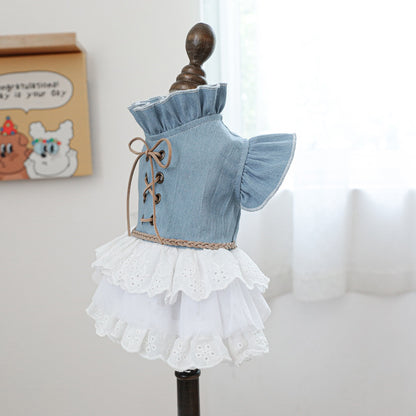 Side profile of the denim and lace pet gown. Showcases the sensory-soft layering and flutter sleeves, making it perfect for weddings or garden parties.