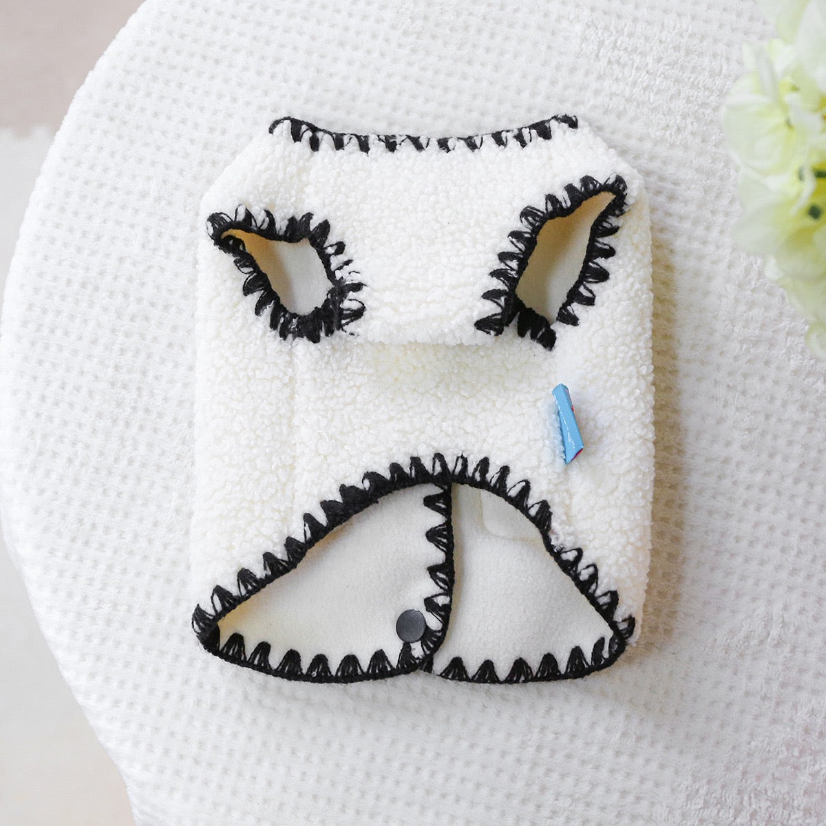 Underside view of the dog vest showing the breathable inner lining and wide armholes for full freedom of movement during play.