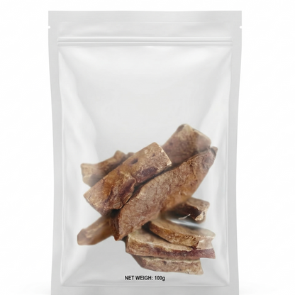 Clear plastic packaging with freeze-dried lamb liver dog treats inside on a white background