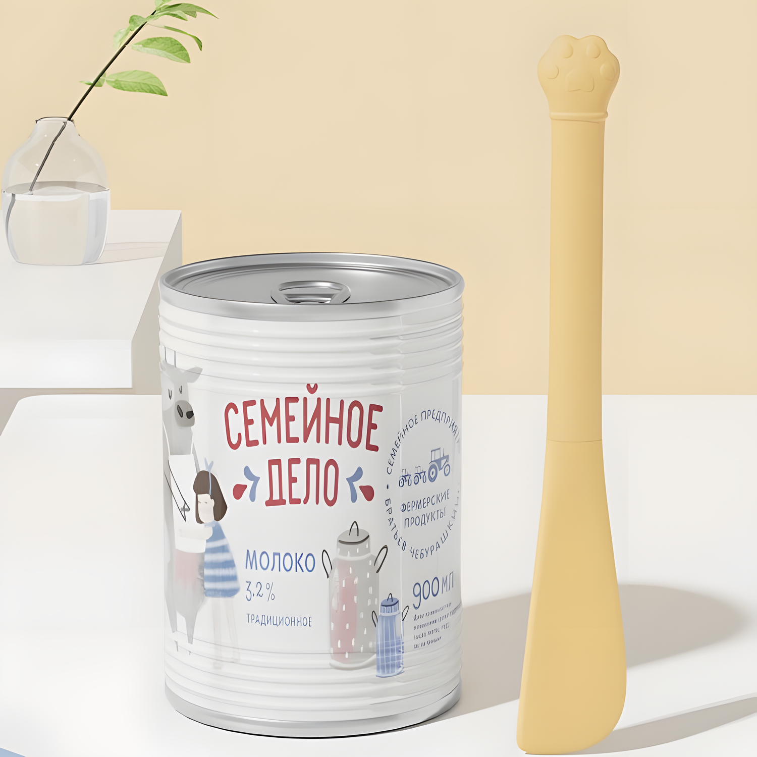 A butter yellow silicone spatula standing vertically next to a large, deep pet food can. The long ergonomic handle is perfect for reaching the bottom of dog and cat food tins.