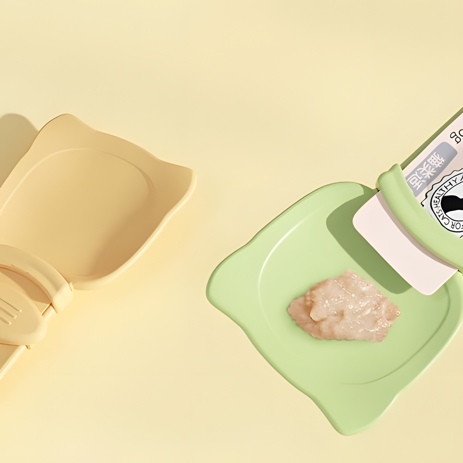Top-down view of the cat liquid treat spoon bowl with puree neatly dispensed onto the green surface, ensuring a mess-free and hygienic feeding experience.
