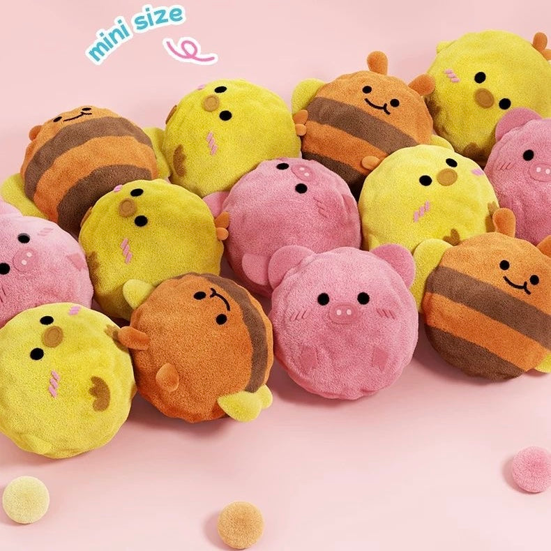 A large pile of the Bouncy Buddies mini plush squeaky balls in bee, chick, and pig designs. The text "mini size" is overlaid, emphasizing their perfect size for small dog mouths.