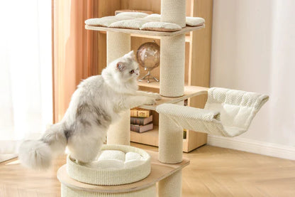 A fluffy white cat exploring the different levels of the minimalist Michu Luna wooden cat tree, featuring a stylish wood and cream aesthetic for contemporary homes.