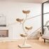 The elegant Michu Ivy tall cat tree shaped like a flower, placed in a minimalist, modern living room with a white fireplace and beautiful sunlight.