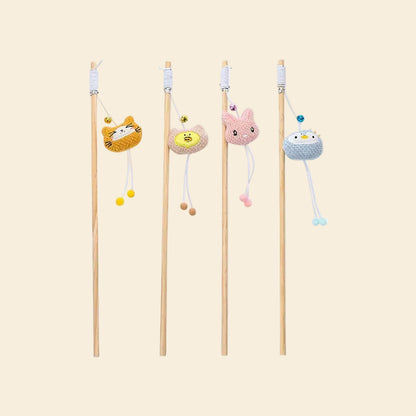 A collection of four LéJoyee natural wood cat teaser wands lined up vertically against a white background, displaying the ultra-soft fleece options: orange cat, beige chick, pink bunny, and blue penguin.