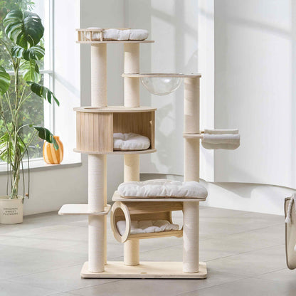 Full front view of a multi-level light-wood cat tree with scratching posts, perches, cat condo, and hammock in a bright living room.