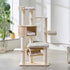 Full front view of a multi-level light-wood cat tree with scratching posts, perches, cat condo, and hammock in a bright living room.