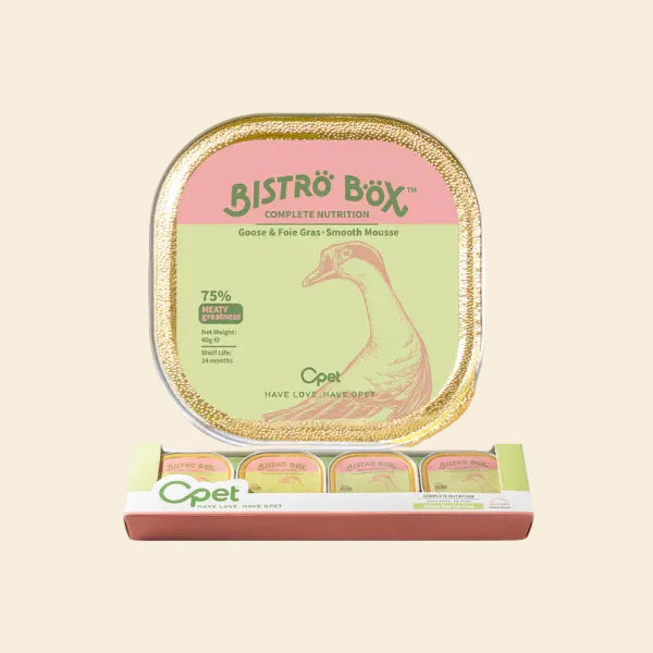 A top-down view of a single OPET Bistro Box Goose &amp; Foie Gras 40g tray placed above its pink and green multipack retail display box. The label features a goose illustration and highlights "75% Meaty Greatness."