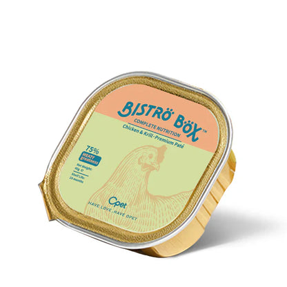 An angled view of a single 40g gold foil tray of OPET Bistro Box Wet Cat Food. The green and peach label features a chicken illustration and highlights "75% Meaty Greatness."