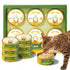 Cat eating Chicken Recipe pâté beside an OPET TRUE BÖWL multipack and several cans