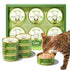 Cat eating from a can of True Bowl pet food with multiple cans and packaging in the background.