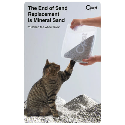 Cat inspecting a bag of OPET white tea scented sodium bentonite mineral cat litter