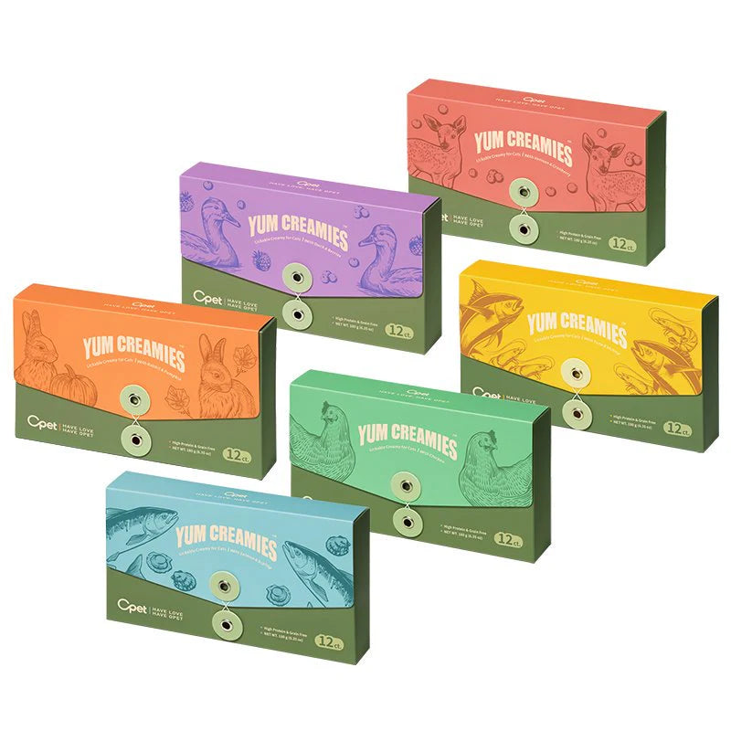 The complete collection of OPET Yum Creamies lickable cat treat boxes on a white background, showing all six flavors including Chicken, Duck, Venison, Rabbit, Tuna, and Salmon.