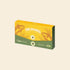 A yellow and green 12-pack box of OPET Yum Creamies lickable cat treats in Tuna & Shrimp flavor, featuring vintage illustrations of a tuna fish and shrimp.