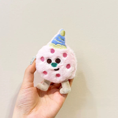 A pink strawberry biscuit plush squeaky toy with a cute embroidered face, showcasing its ultra-soft and bite-friendly plush fabric.