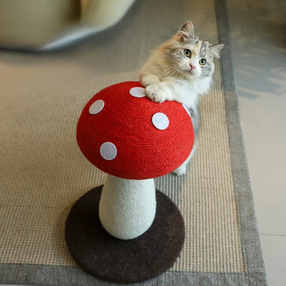 A playful cat interacting with the bright red, polka-dotted cap of the mushroom scratching post, satisfying its natural feline instincts.