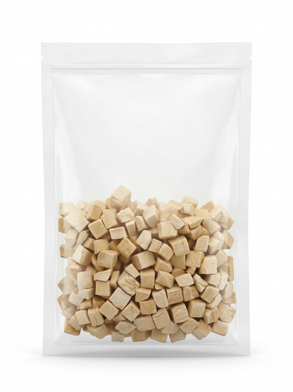 A clean studio shot of a clear stand-up pouch filled with portion-controlled freeze-dried chicken cubes, perfect for mess-free everyday positive reinforcement training.