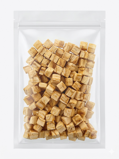 A clean studio shot of a clear stand-up pouch filled with portion-controlled freeze-dried cod cubes, perfect for low-fat pet training rewards.